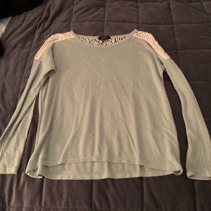 mint green blouse.